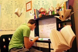 boy studying on his table